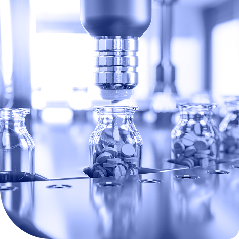 Pills being put into bottles on assembly line
