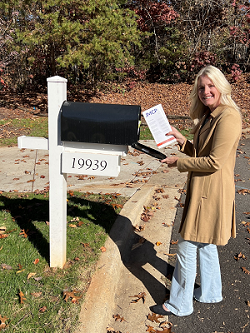 Laura Happe receiving the new issue of JMCP at her mailbox.